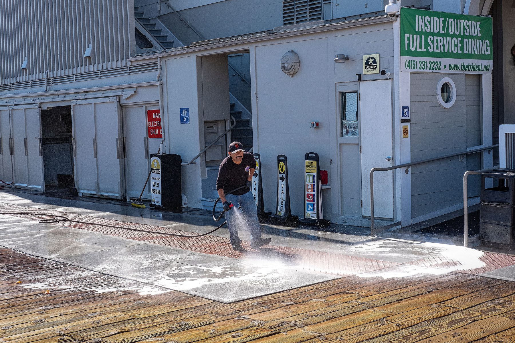Pressure washing concrete sidewalk clean