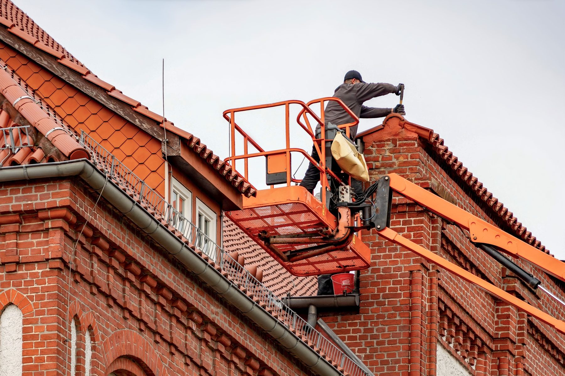 Roof maintenance and moss removal in progress